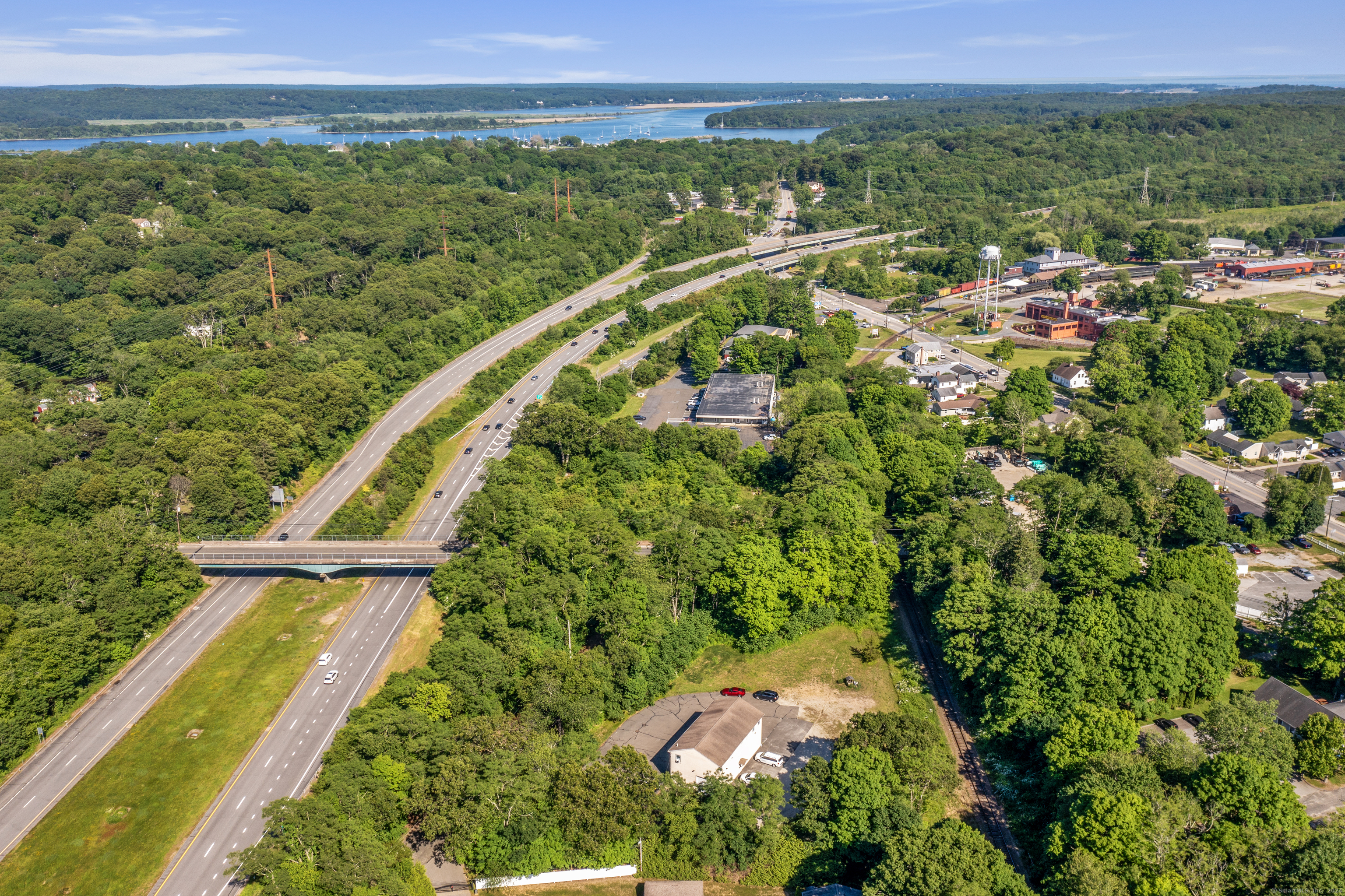 130 Dennison Road Essex, CT 06426 - Photo 3 of 9 a view of a city with lush green forest