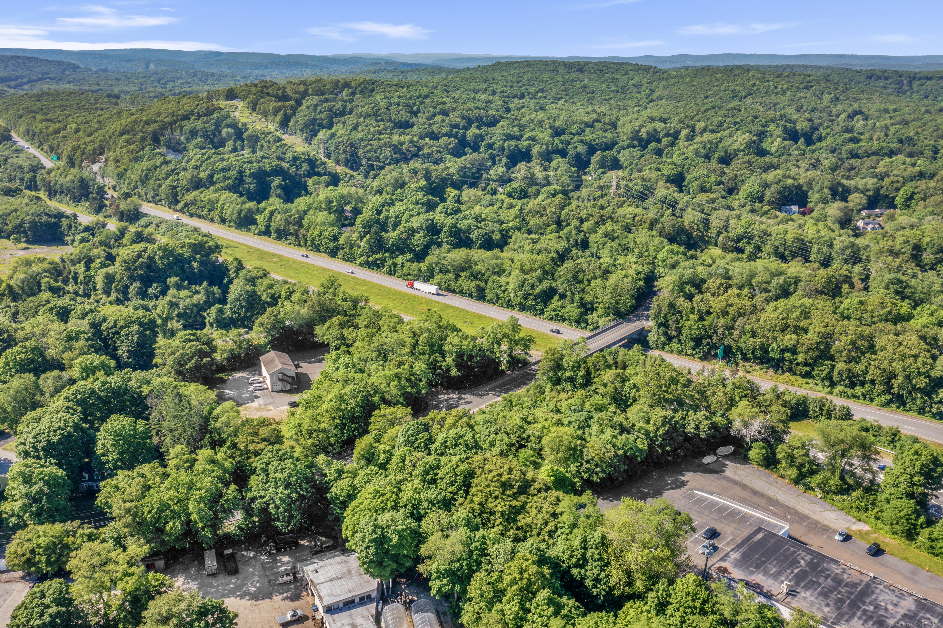 130 Dennison Road Essex, CT 06426 - Photo 7 of 9 a view of a city with lush green forest