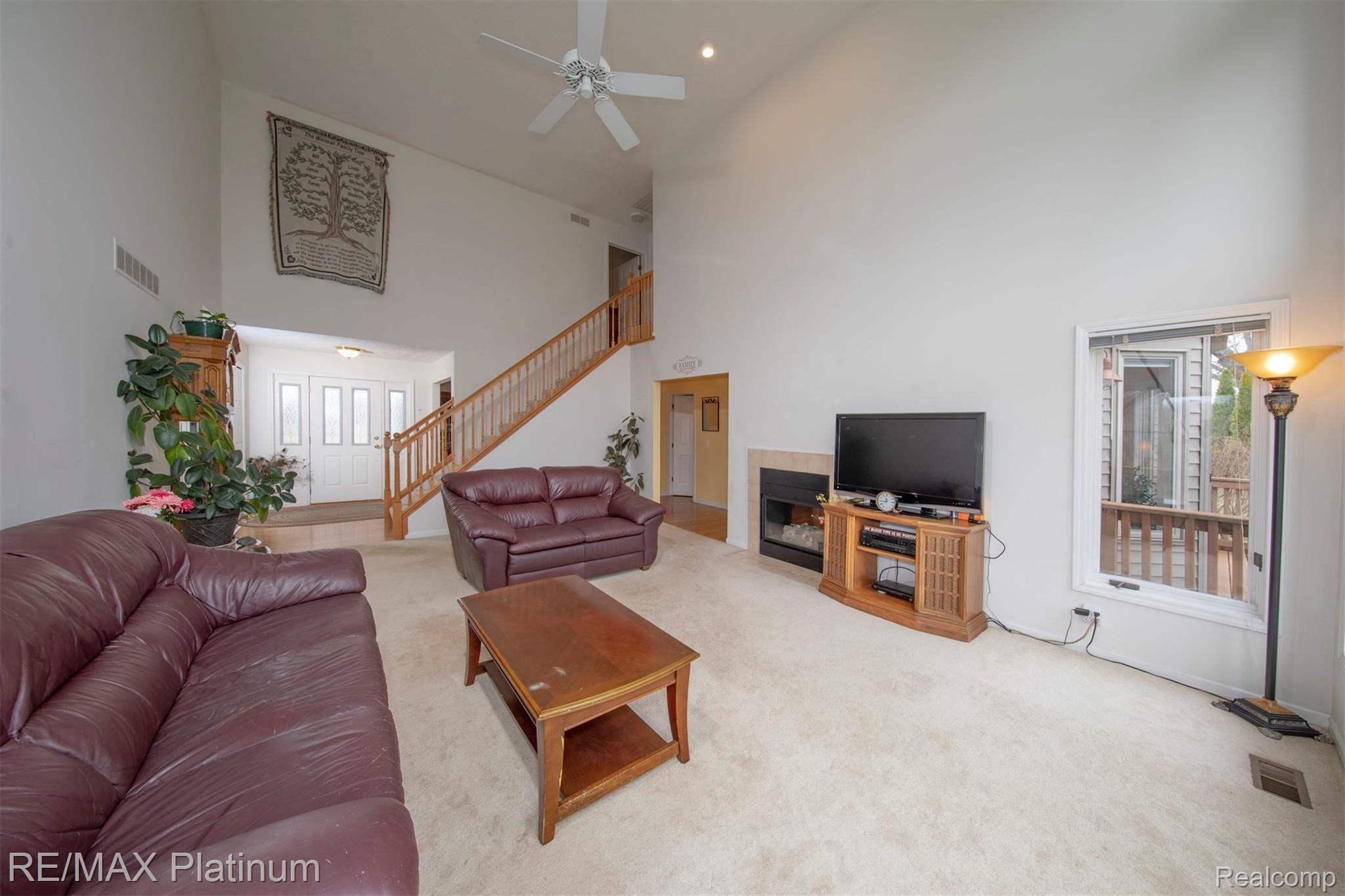 2500 Ridgewood Drive Howell, MI 48843 - Photo 4 of 31 Feature Staircase and two way gas fireplace