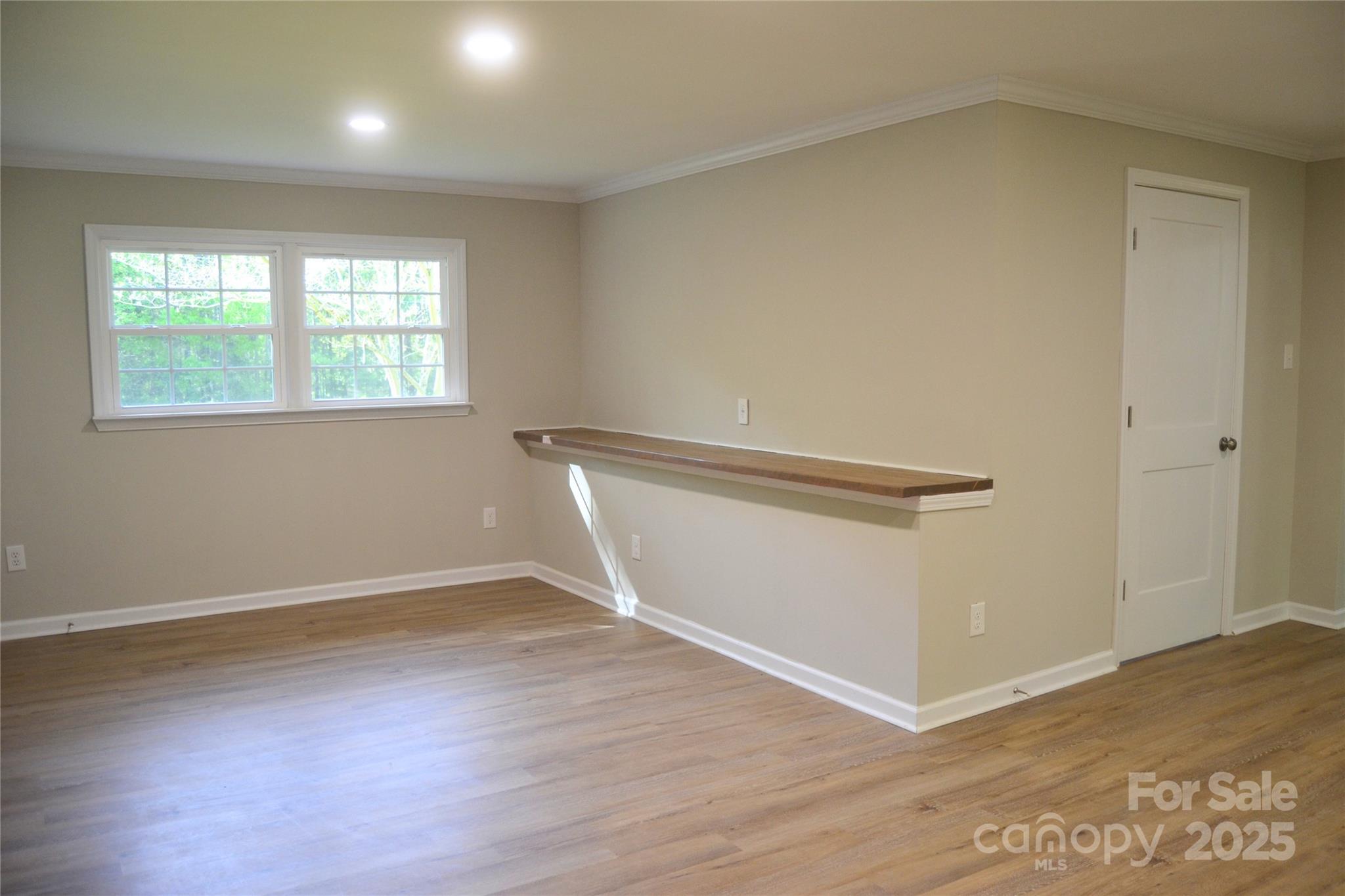 6726 Lockhart Road Sharon, SC 29742 - Photo 12 of 23 an empty room with wooden floor and windows