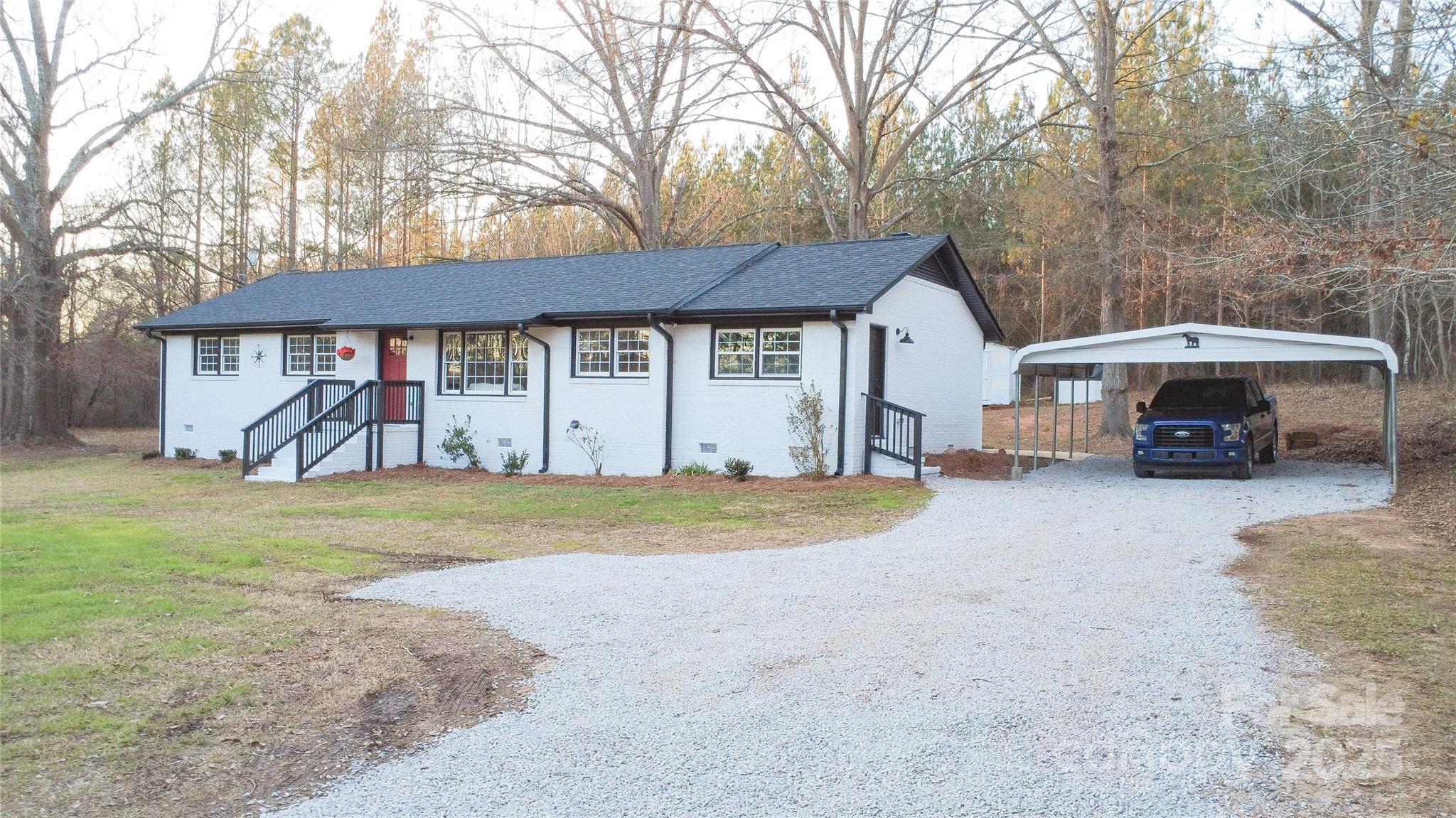6726 Lockhart Road Sharon, SC 29742 - Photo 3 of 23 a view of a house with backyard and a trees