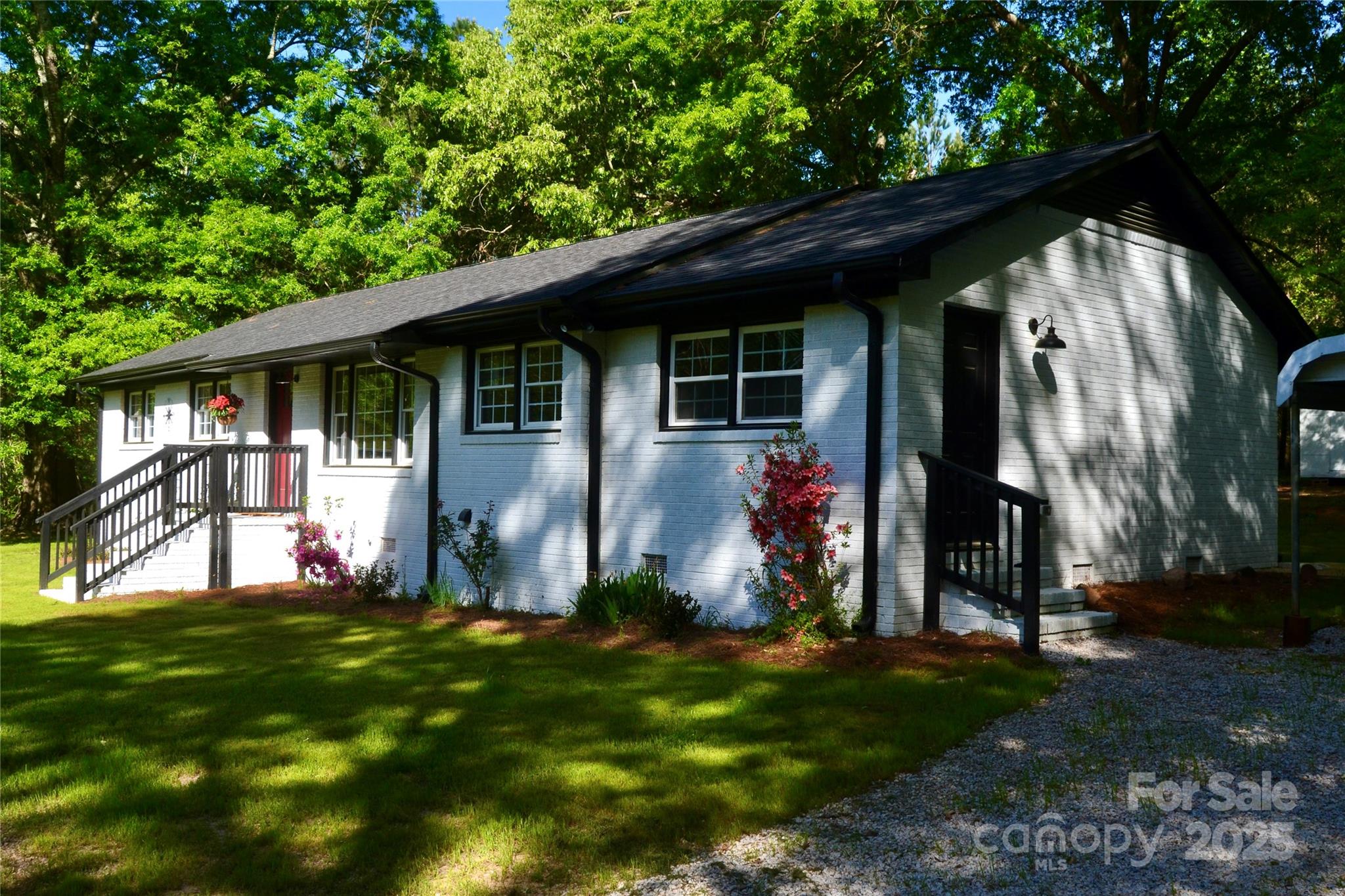 6726 Lockhart Road Sharon, SC 29742 - Photo 5 of 23 a backyard of a house with table and chairs