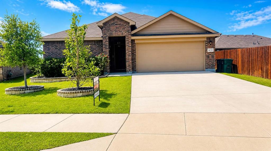 16729 Milwaukee Street Justin, TX 76247 - Photo 1 of 23 a view of a house with a yard