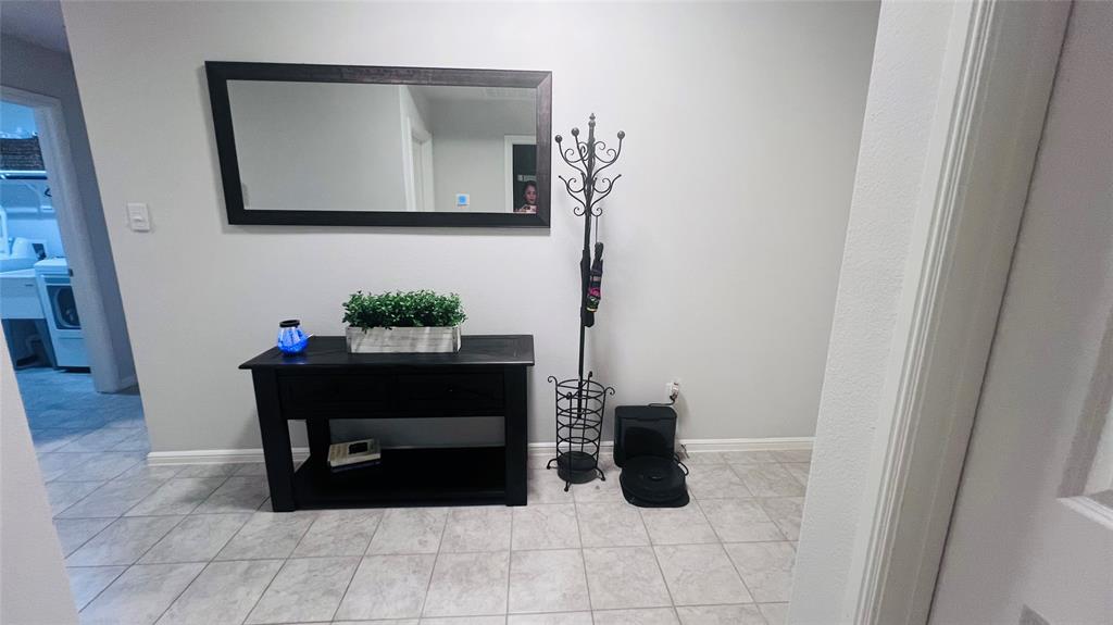 16729 Milwaukee Street Justin, TX 76247 - Photo 3 of 23 a living room with furniture and flat screen tv
