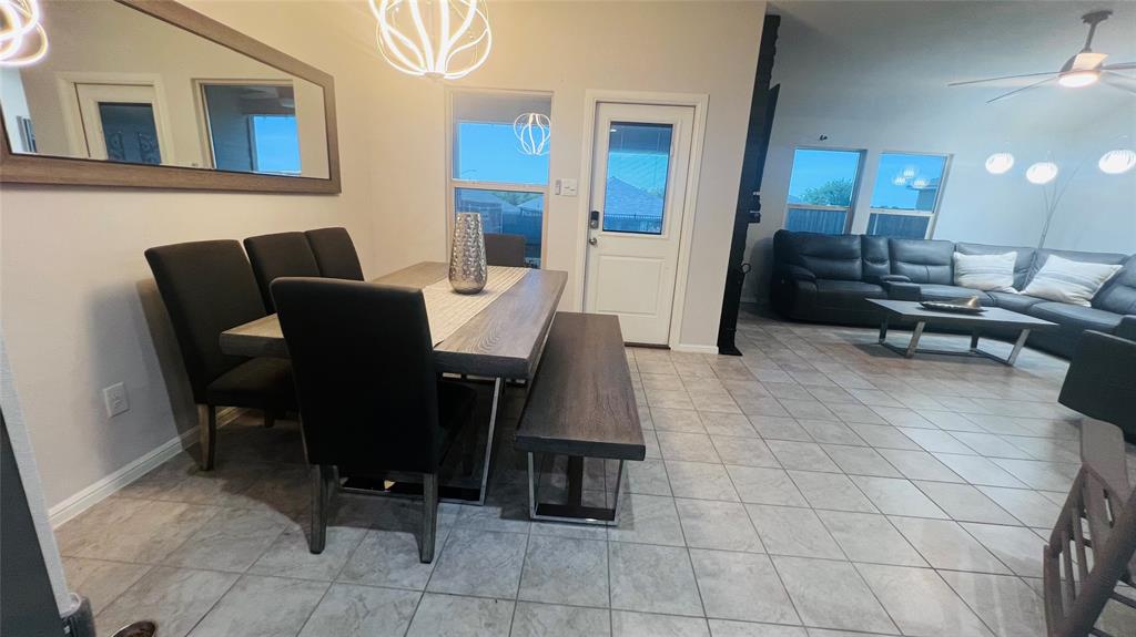 16729 Milwaukee Street Justin, TX 76247 - Photo 10 of 23 a view of a dining room with furniture