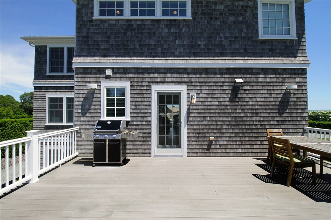 426 Tuckerman Avenue Middletown, RI 02842 - Photo 7 of 32 Back deck. Underneath is a large two car garage and outdoor shed.
