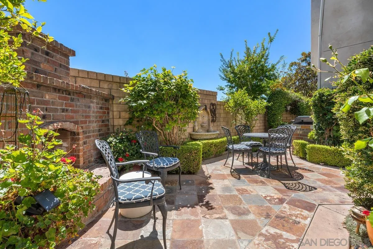 1329 Caminito Balada La Jolla, CA 92037 - Photo 13 of 31 a view of a chairs and table in a backyard