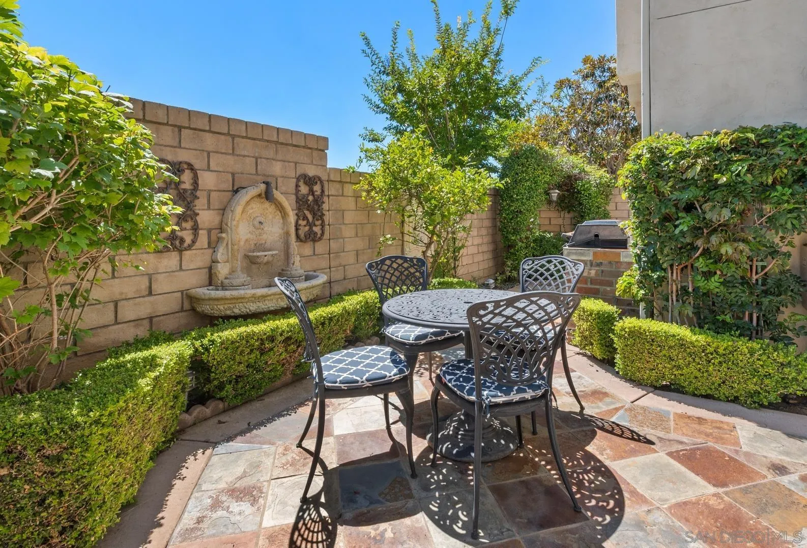1329 Caminito Balada La Jolla, CA 92037 - Photo 14 of 31 a view of a chairs and table in backyard