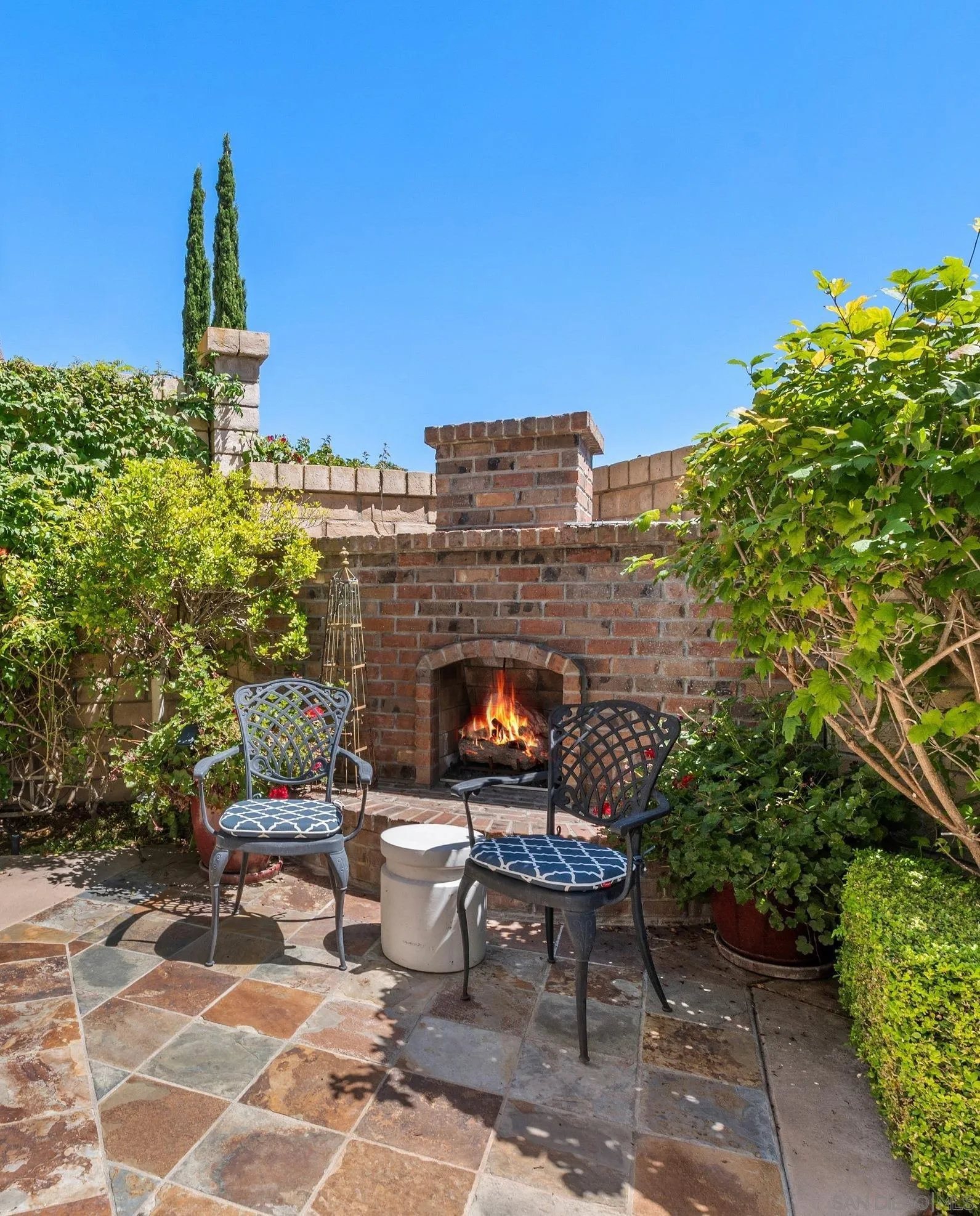 1329 Caminito Balada La Jolla, CA 92037 - Photo 15 of 31 a view of a patio with table and chairs and potted plants