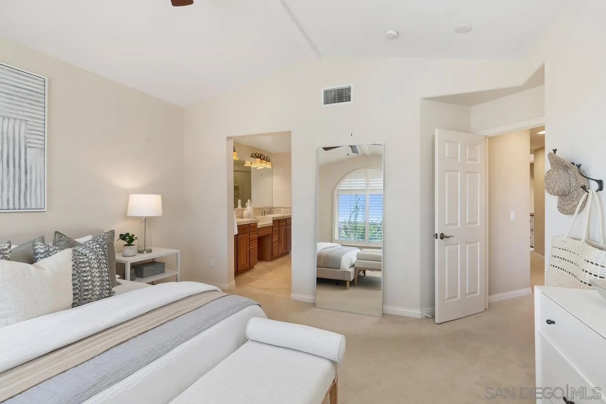 1329 Caminito Balada La Jolla, CA 92037 - Photo 17 of 31 a room with a bed and a large mirror