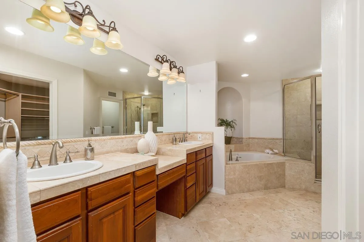 1329 Caminito Balada La Jolla, CA 92037 - Photo 18 of 31 a spacious bathroom with a double vanity sink mirror and bathtub