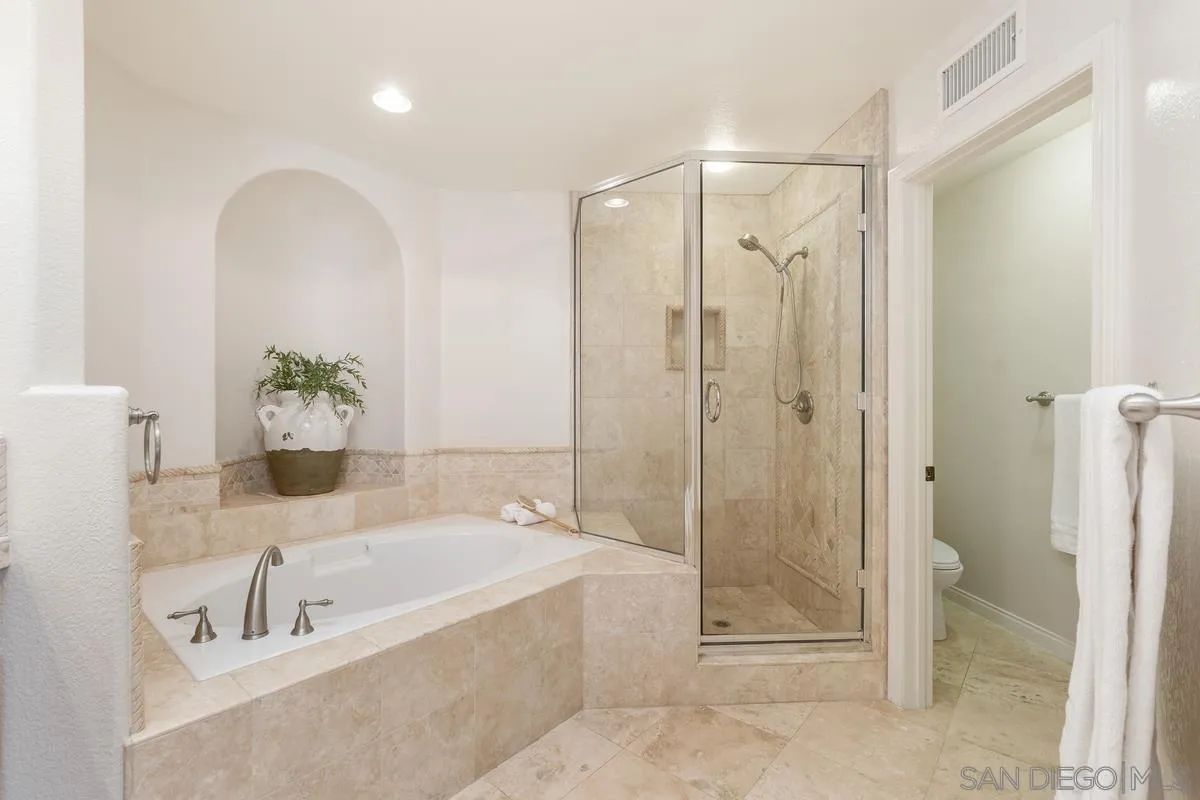 1329 Caminito Balada La Jolla, CA 92037 - Photo 19 of 31 a bathroom with a tub shower and sink