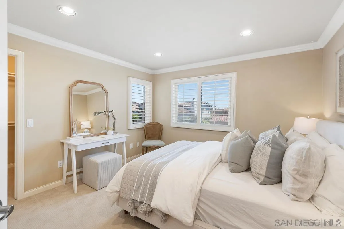 1329 Caminito Balada La Jolla, CA 92037 - Photo 21 of 31 a bedroom with a bed and a large window