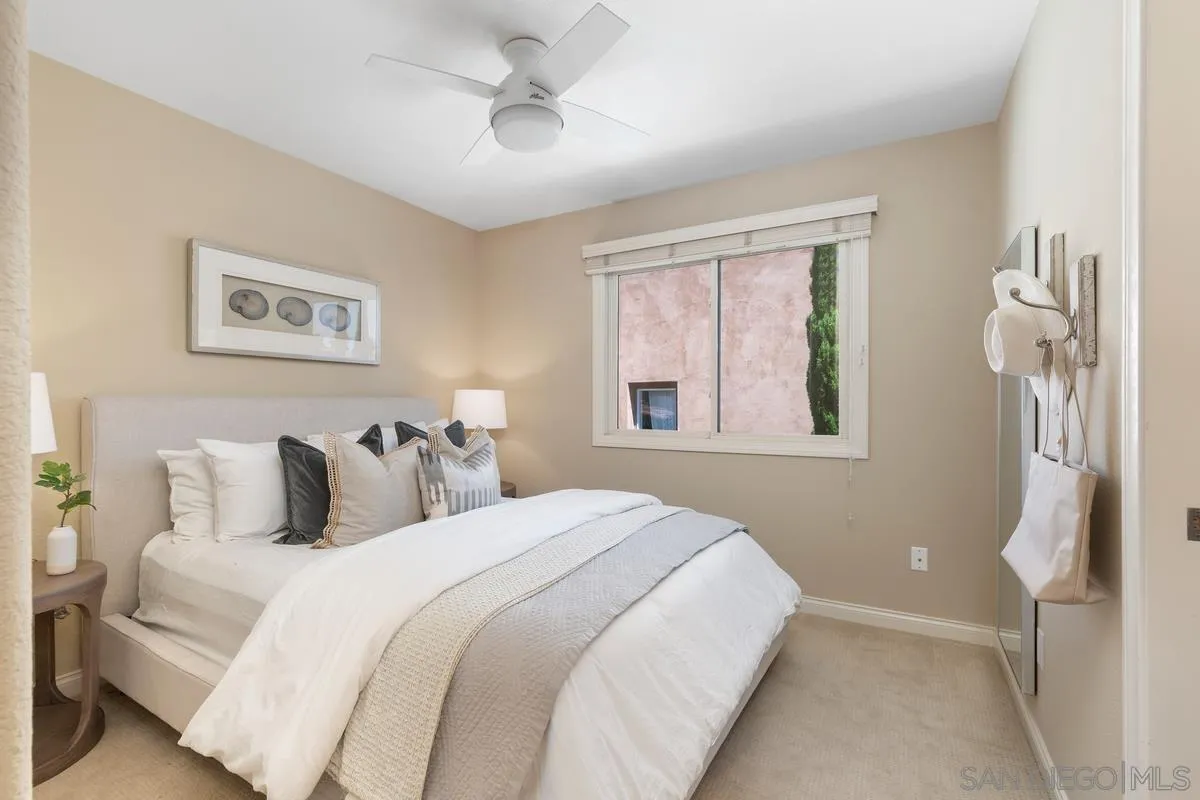 1329 Caminito Balada La Jolla, CA 92037 - Photo 23 of 31 a bedroom with a bed and a window