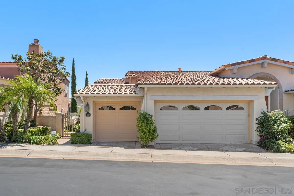 1329 Caminito Balada La Jolla, CA 92037 - Photo 26 of 31 a front view of a house with a garage
