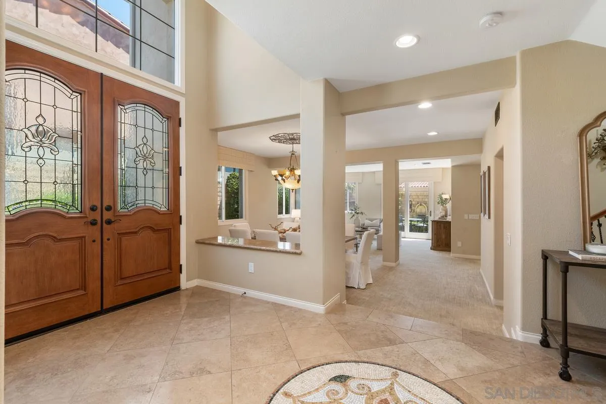 1329 Caminito Balada La Jolla, CA 92037 - Photo 3 of 31 a living room with furniture a large window stainless steel appliances