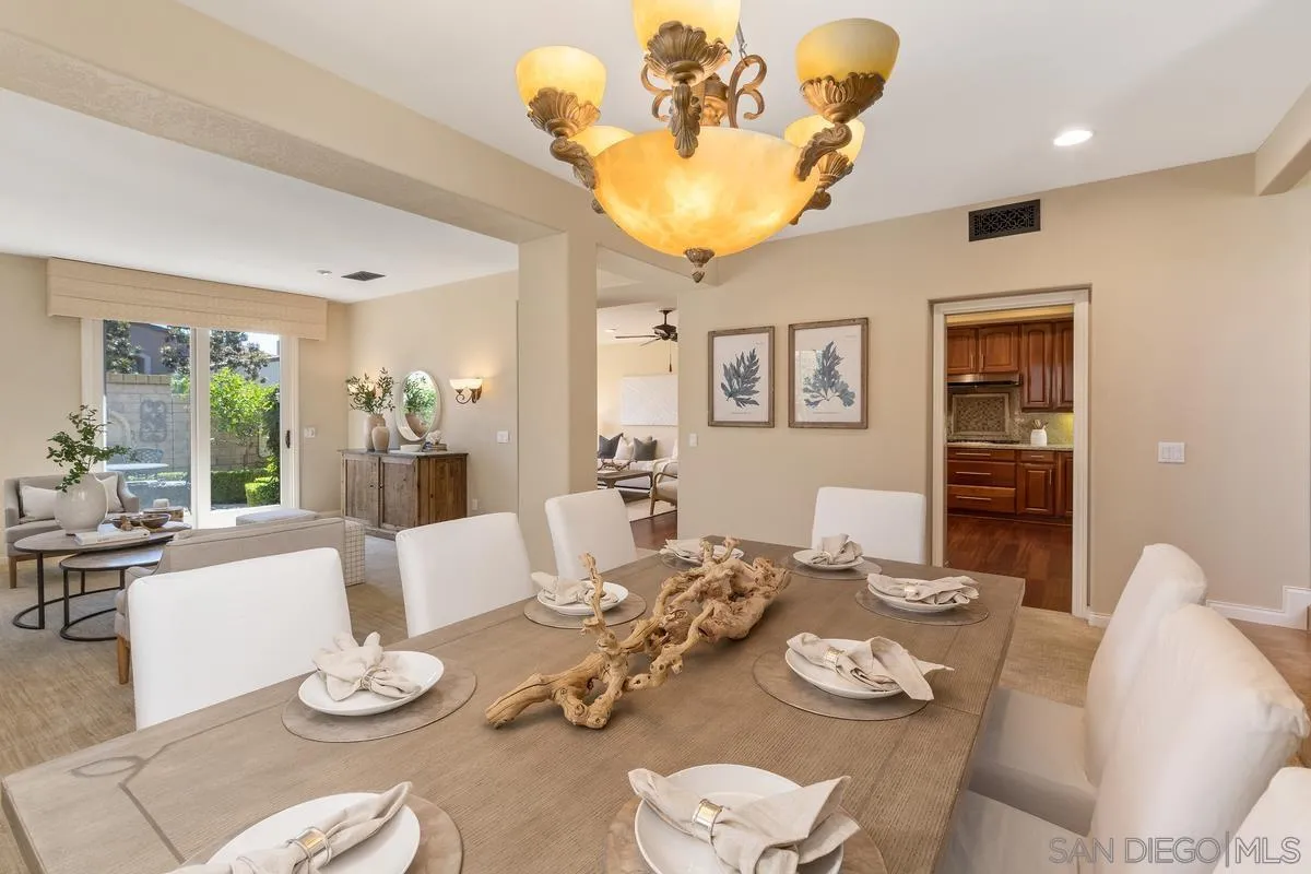 1329 Caminito Balada La Jolla, CA 92037 - Photo 5 of 31 a dining room with furniture a rug and wooden floor