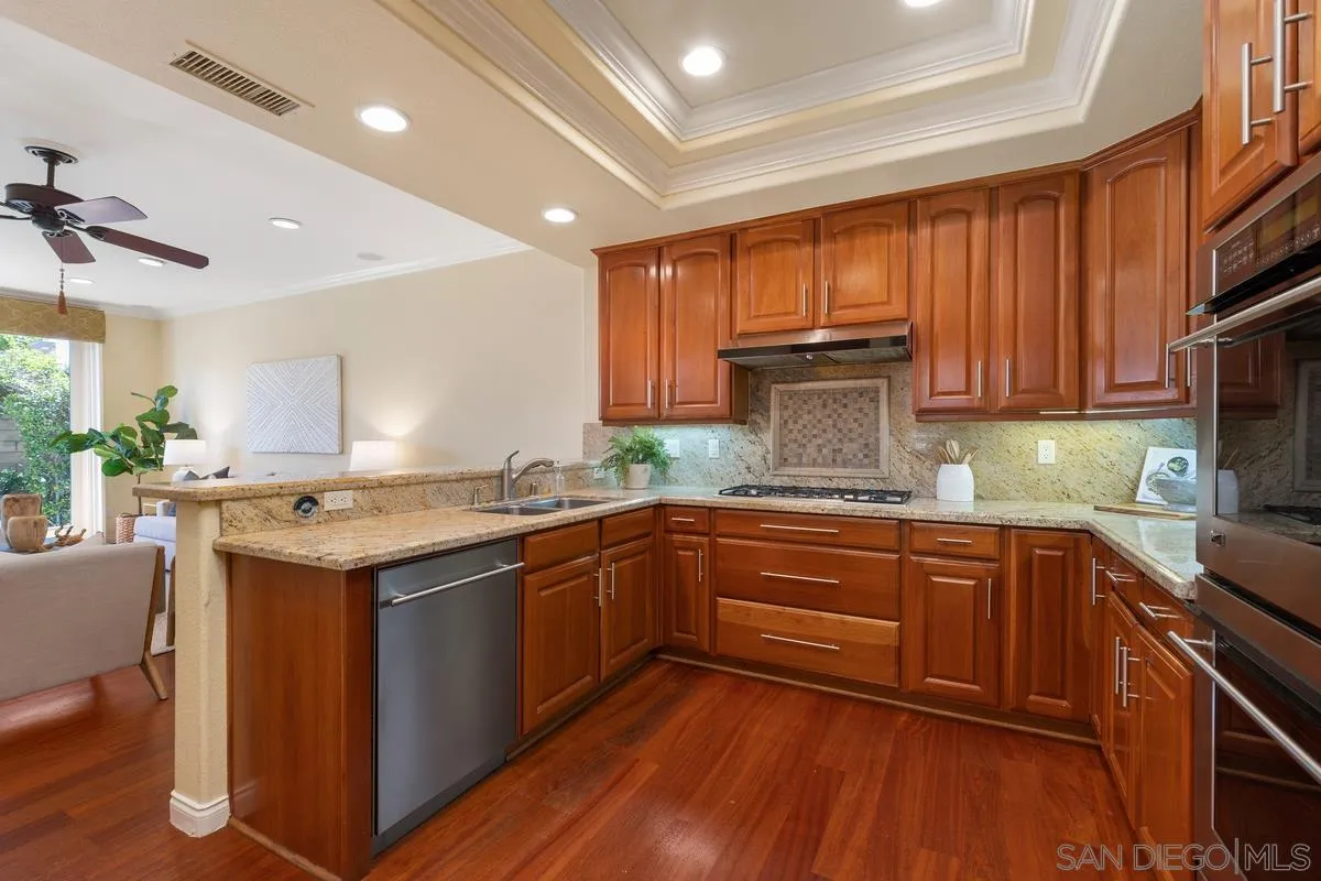 1329 Caminito Balada La Jolla, CA 92037 - Photo 8 of 31 a kitchen with a sink stove and cabinets