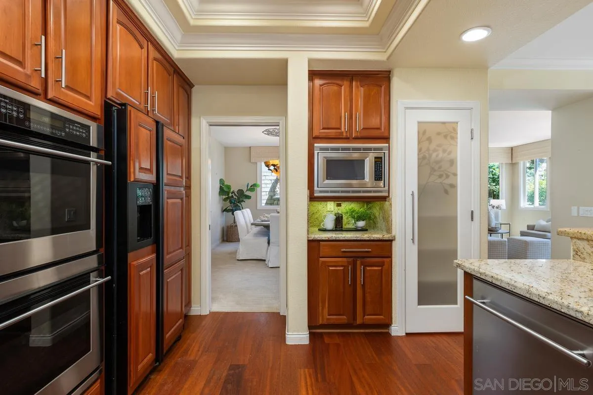 1329 Caminito Balada La Jolla, CA 92037 - Photo 9 of 31 a view of a kitchen cabinets and wooden floor