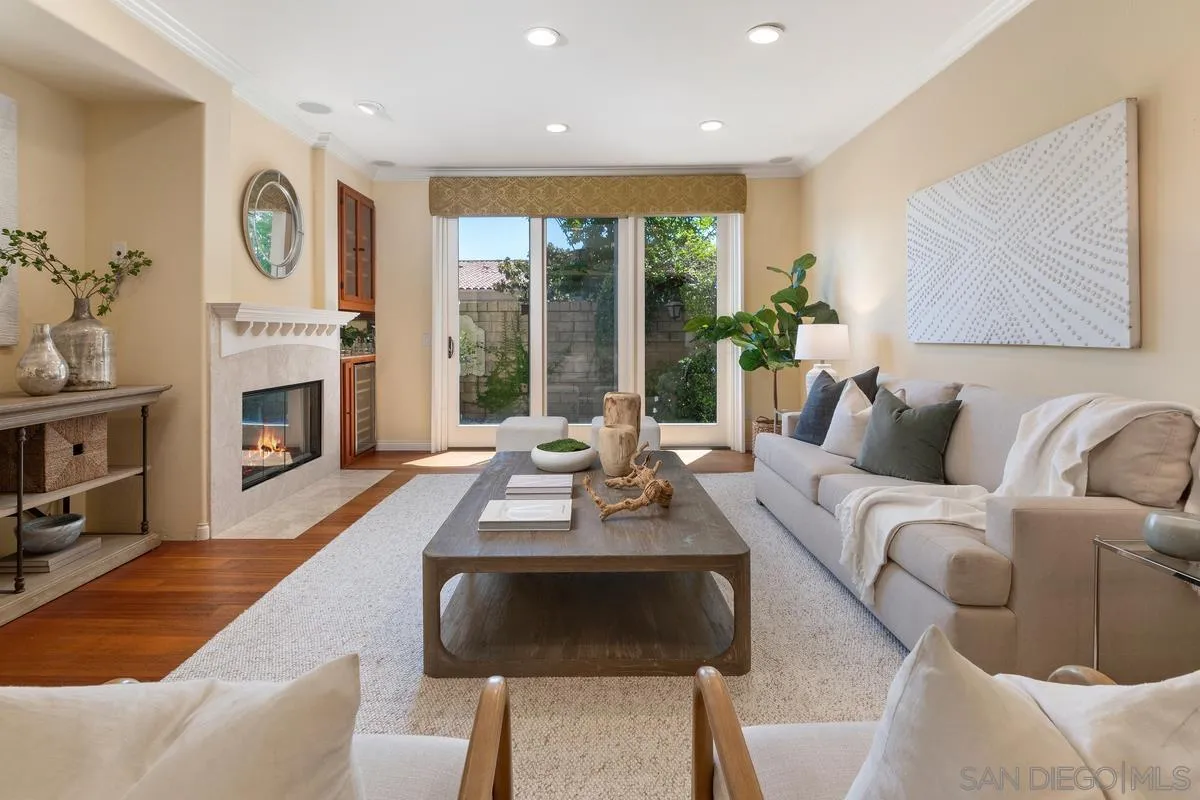 1329 Caminito Balada La Jolla, CA 92037 - Photo 10 of 31 a living room with furniture fireplace and flat screen tv