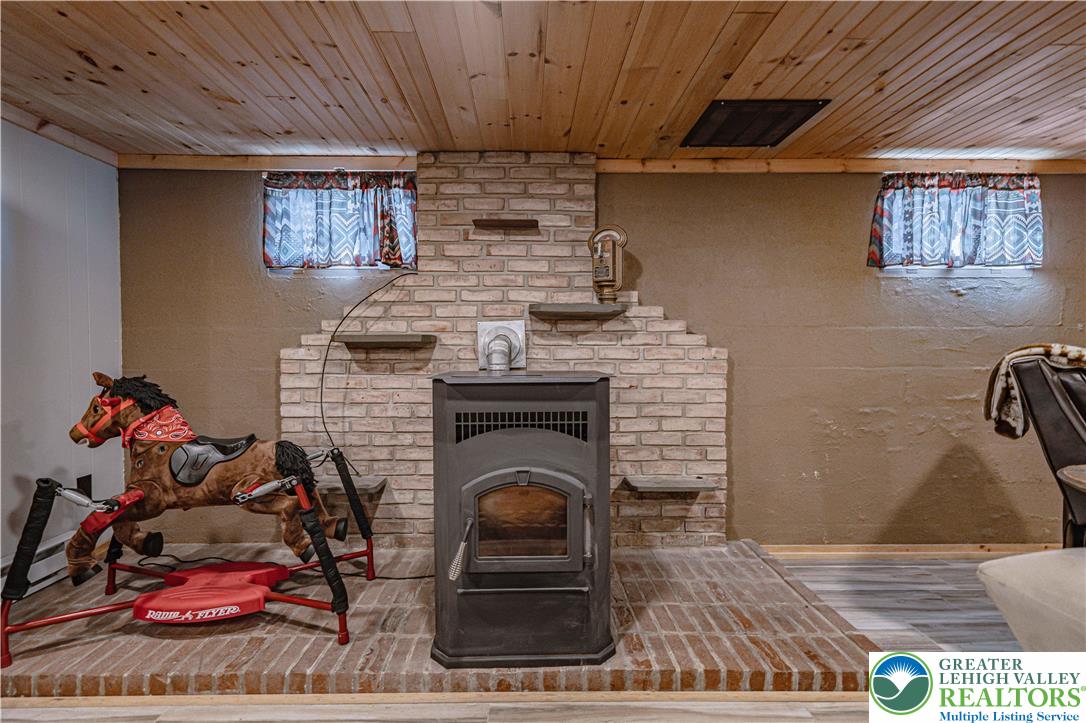 544 School Road Nazareth, PA 18064 - Photo 25 of 35 a living room with furniture and a fireplace
