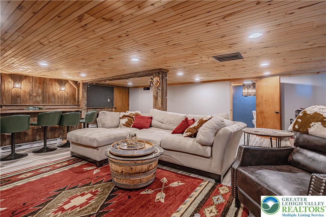 544 School Road Nazareth, PA 18064 - Photo 26 of 35 a living room with furniture a fireplace and a table