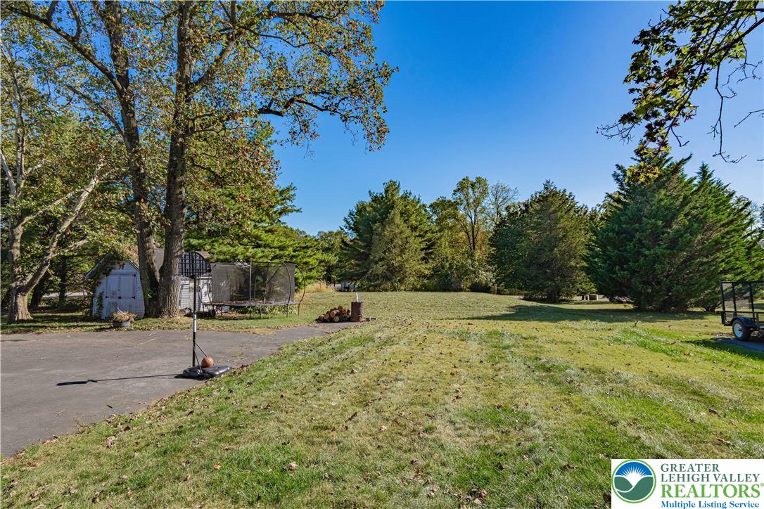 544 School Road Nazareth, PA 18064 - Photo 32 of 35 a backyard of a house with lots of green space