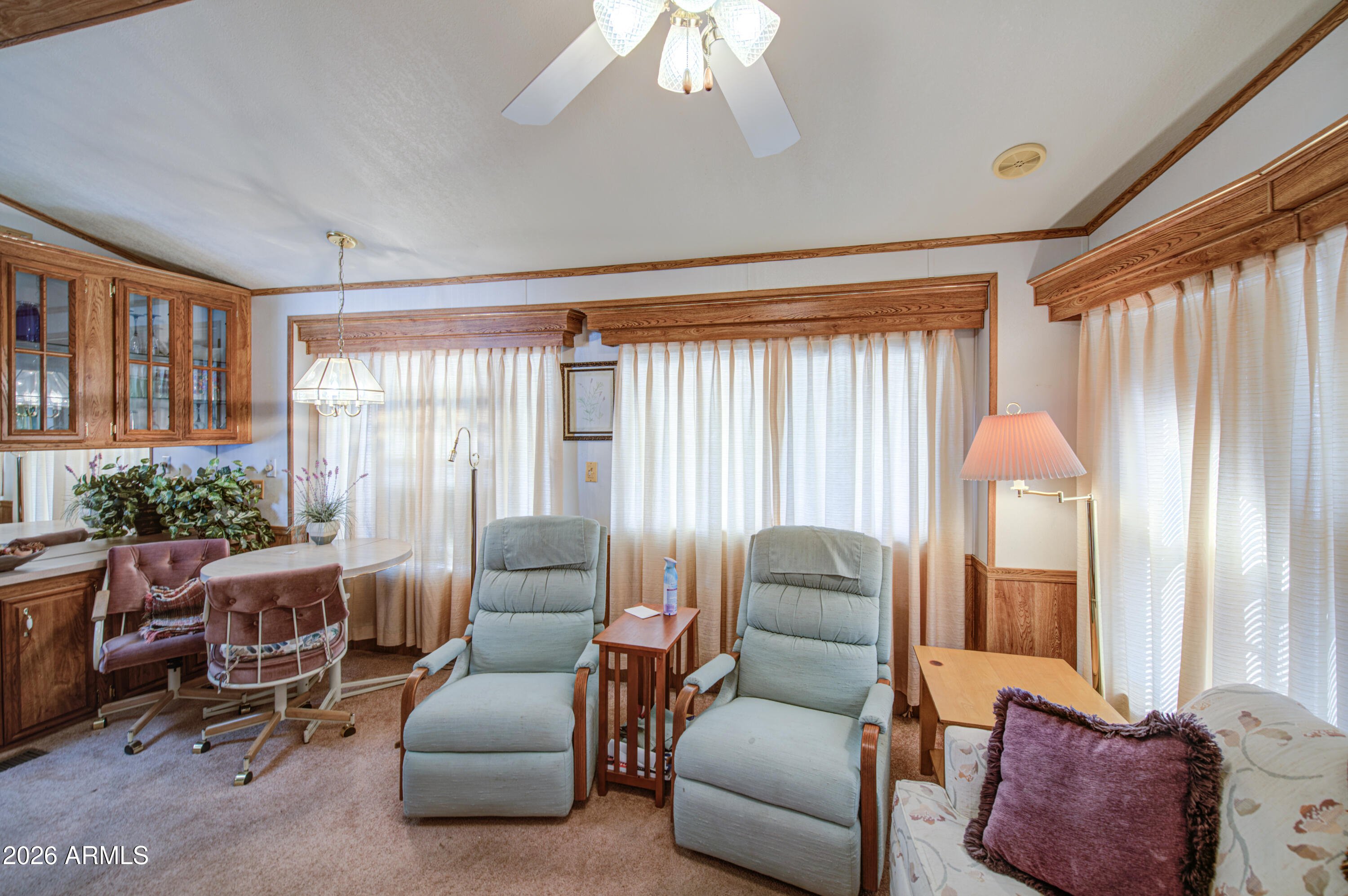 7750 East Broadway Road, Unit 512 Mesa, AZ 85208 - Photo 13 of 32 a living room with furniture and a large window