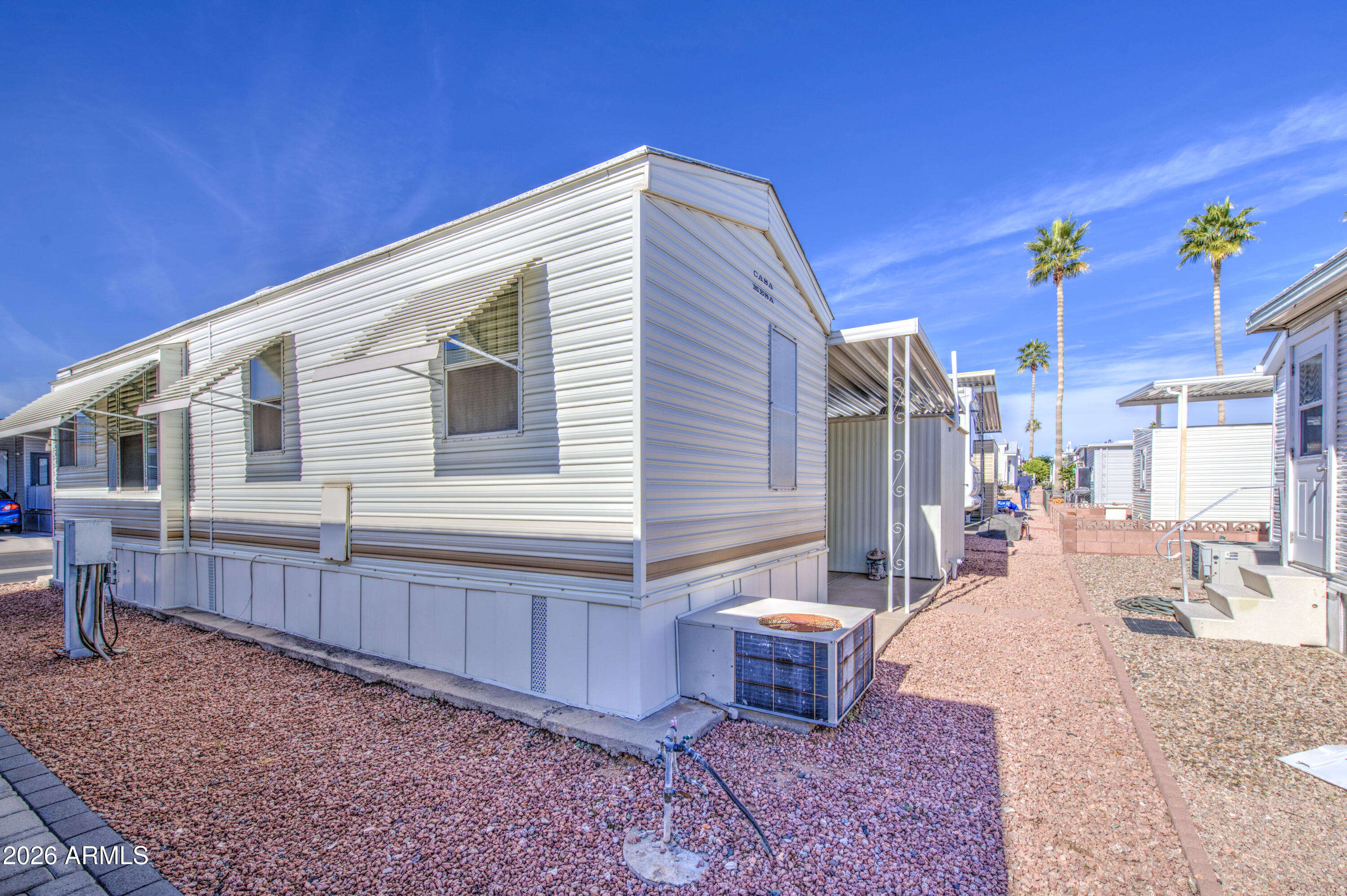 7750 East Broadway Road, Unit 512 Mesa, AZ 85208 - Photo 16 of 32 a view of a house with backyard and sitting area
