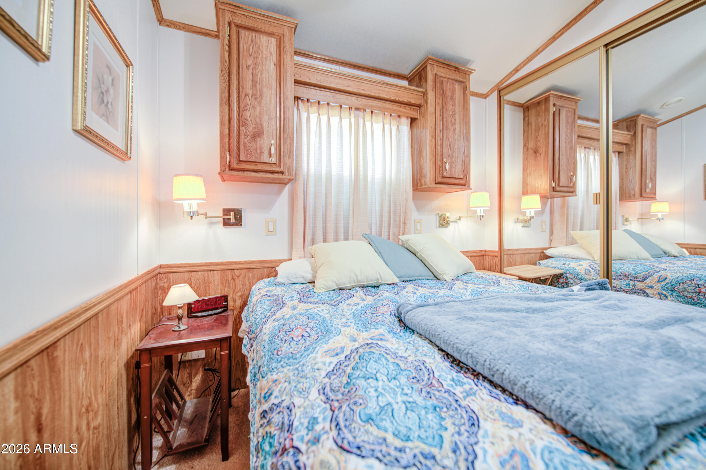 7750 East Broadway Road, Unit 512 Mesa, AZ 85208 - Photo 2 of 32 a bedroom with a bed next to a window