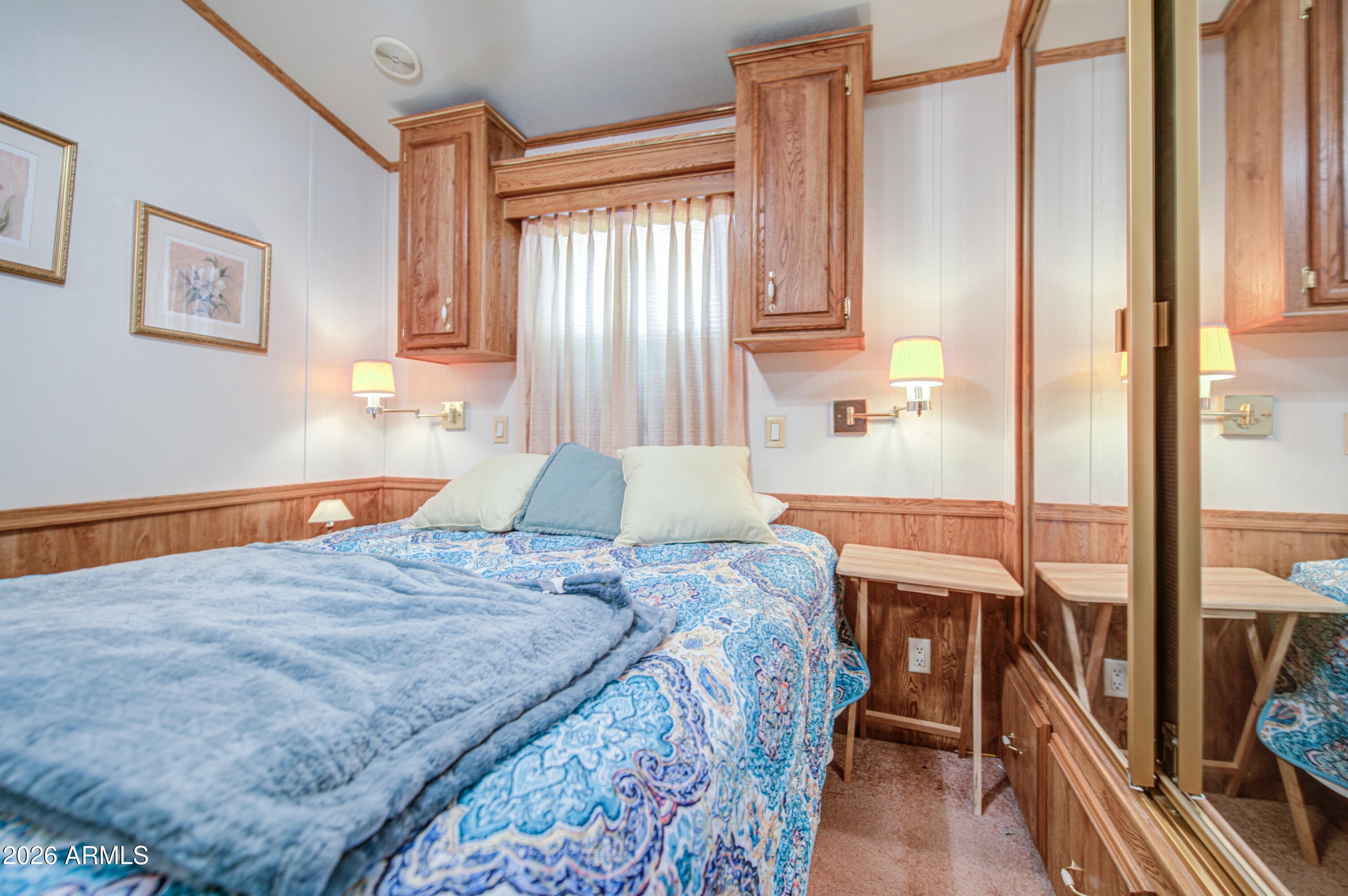 7750 East Broadway Road, Unit 512 Mesa, AZ 85208 - Photo 21 of 32 a bedroom with a bed and a dresser next to a window