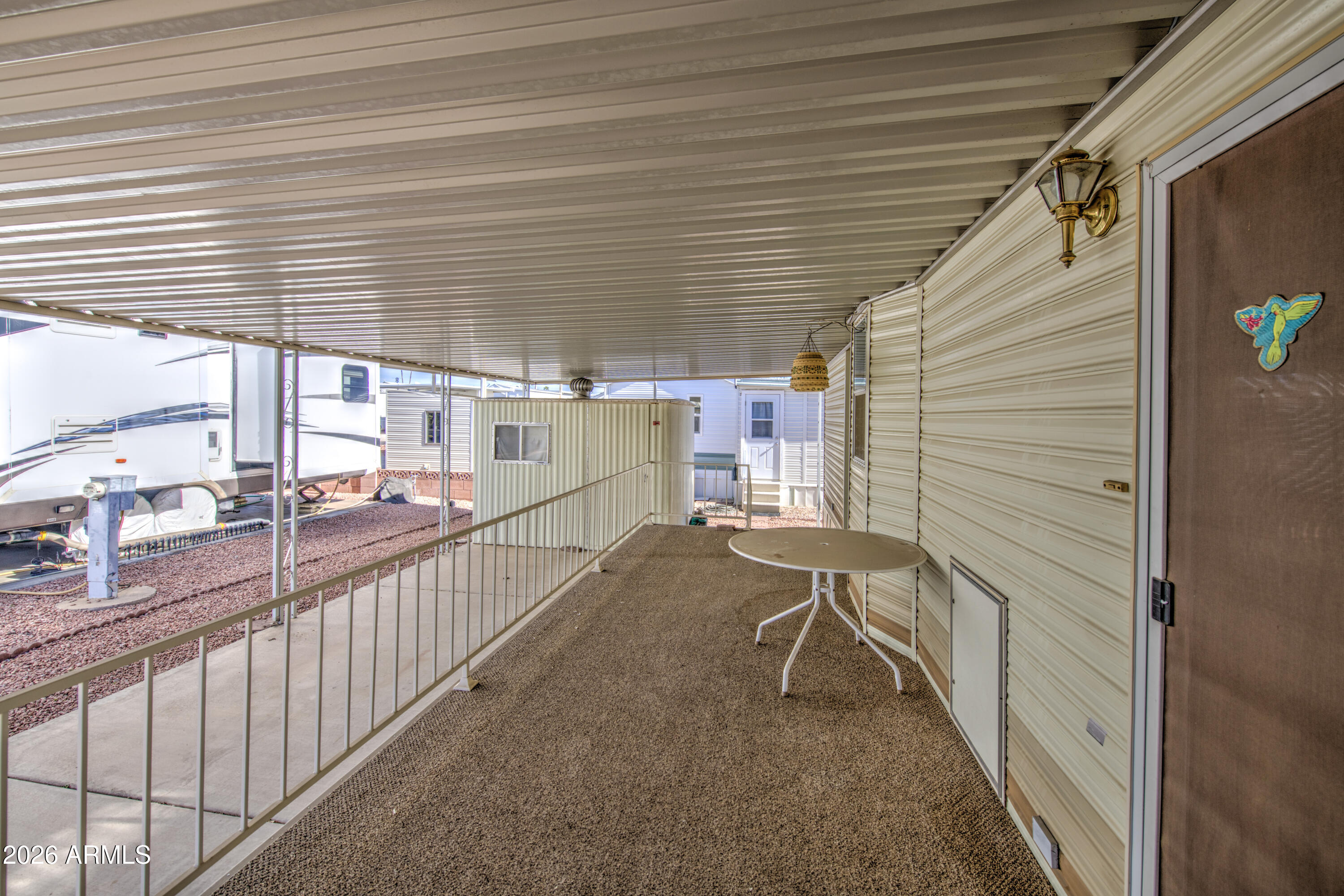 7750 East Broadway Road, Unit 512 Mesa, AZ 85208 - Photo 6 of 32 a view of a porch with furniture