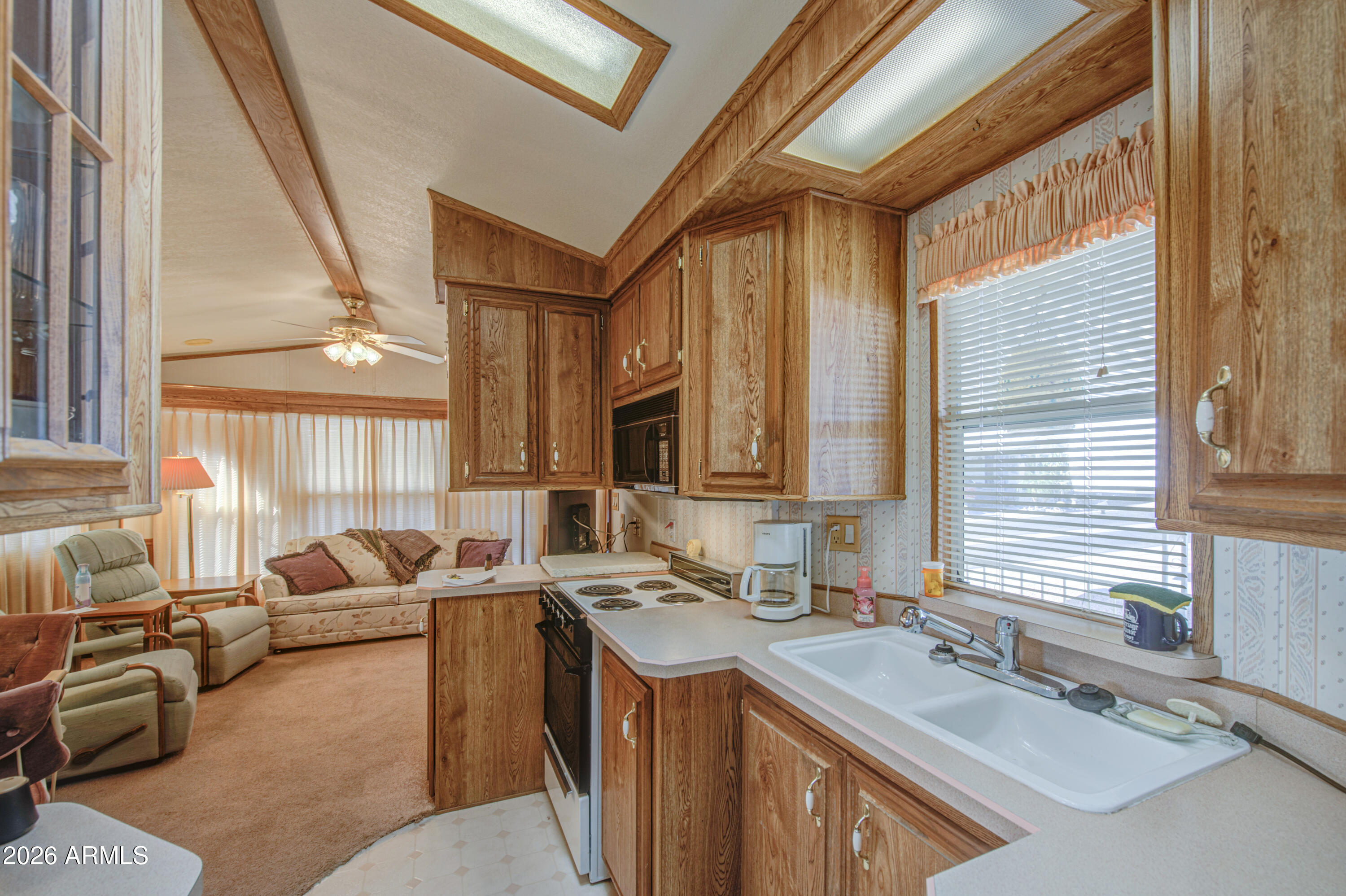 7750 East Broadway Road, Unit 512 Mesa, AZ 85208 - Photo 9 of 32 a bathroom with a granite countertop sink and a large mirror