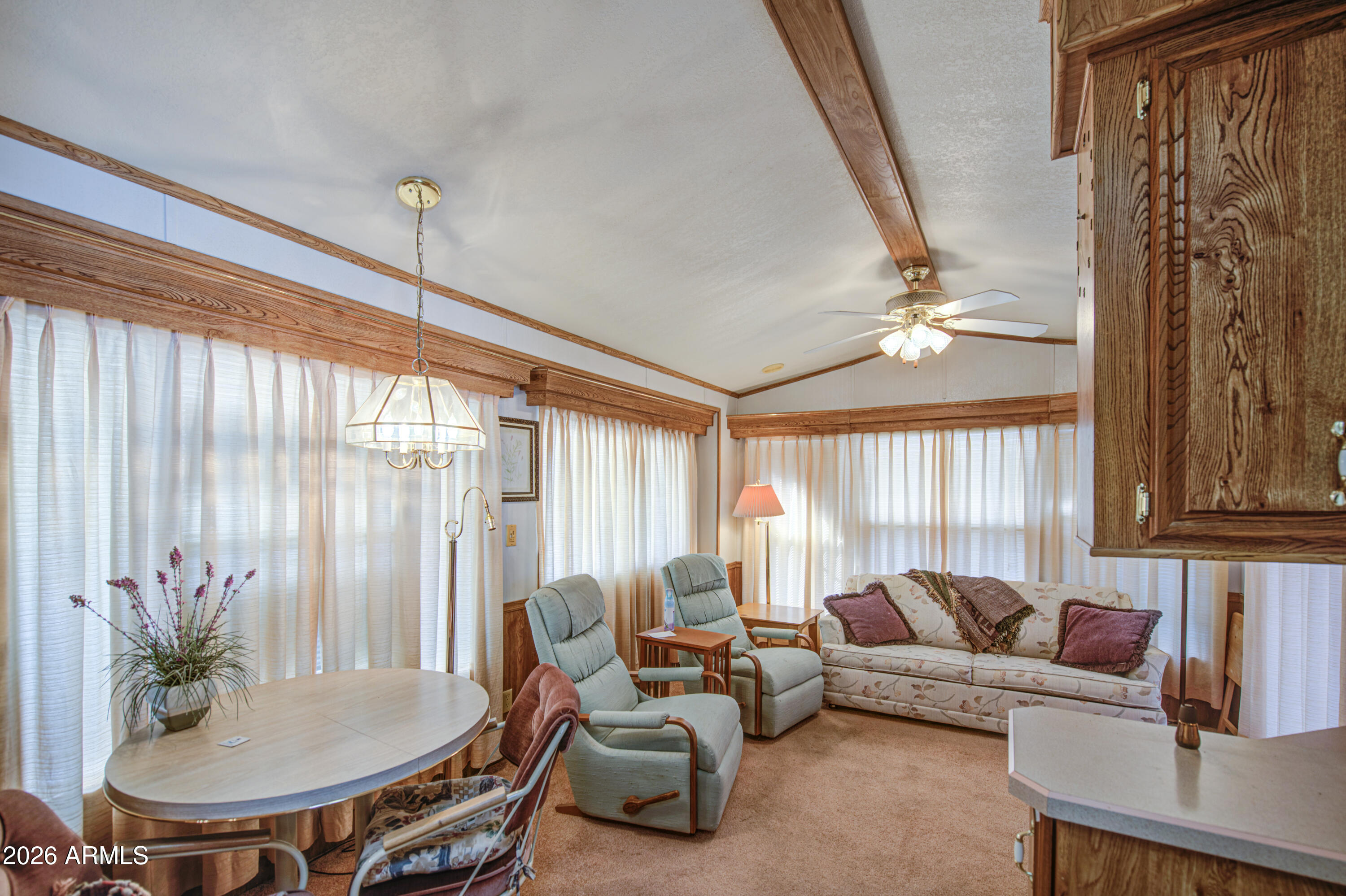 7750 East Broadway Road, Unit 512 Mesa, AZ 85208 - Photo 10 of 32 a living room with furniture and a large window