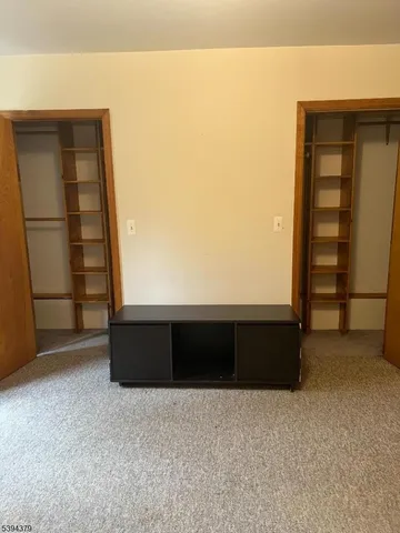 an empty room with wooden floor