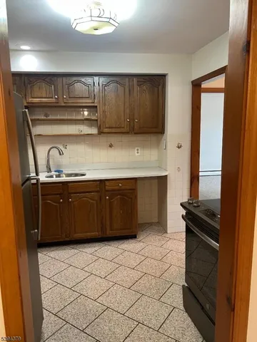 a kitchen with a sink and cabinets