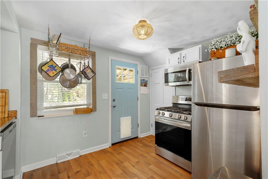 200 Fox Chapel Road Pittsburgh, PA 15238 - Photo 12 of 32 a kitchen with stainless steel appliances a refrigerator and a stove top oven