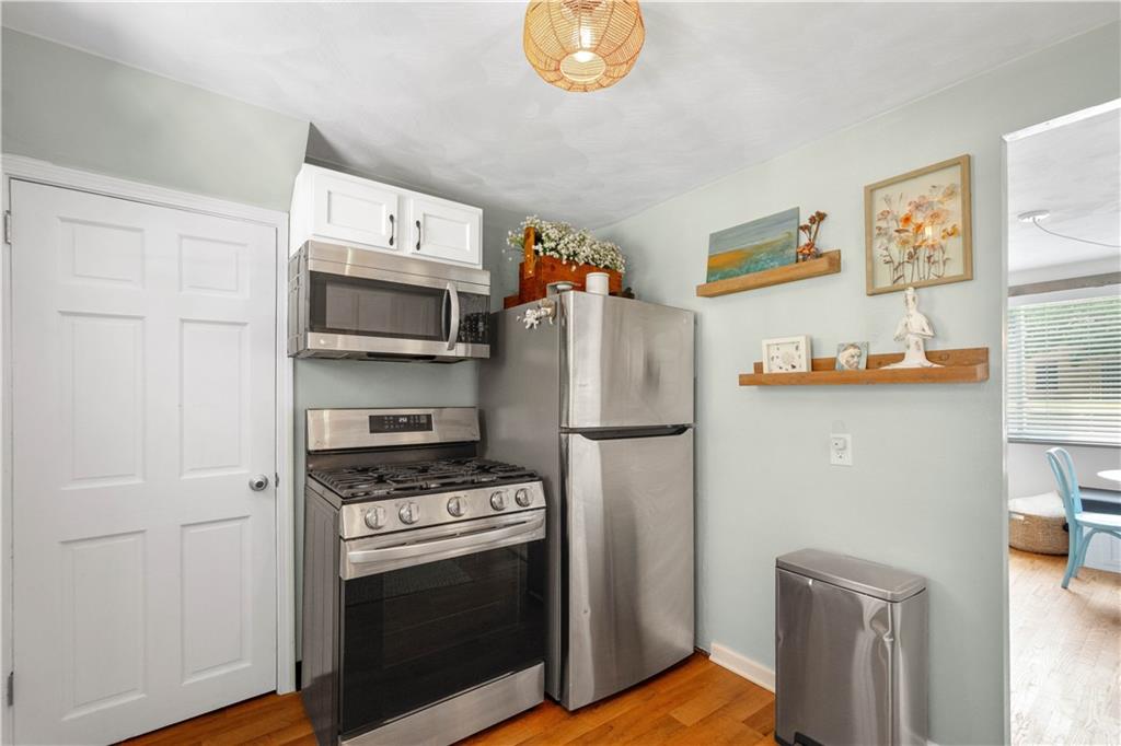 200 Fox Chapel Road Pittsburgh, PA 15238 - Photo 13 of 32 a kitchen with stainless steel appliances a stove a microwave and a refrigerator