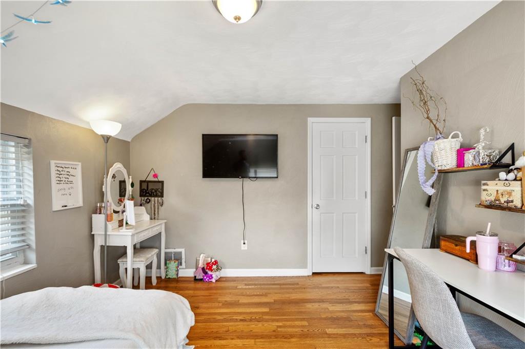 200 Fox Chapel Road Pittsburgh, PA 15238 - Photo 17 of 32 a bedroom with a bed and a flat screen tv