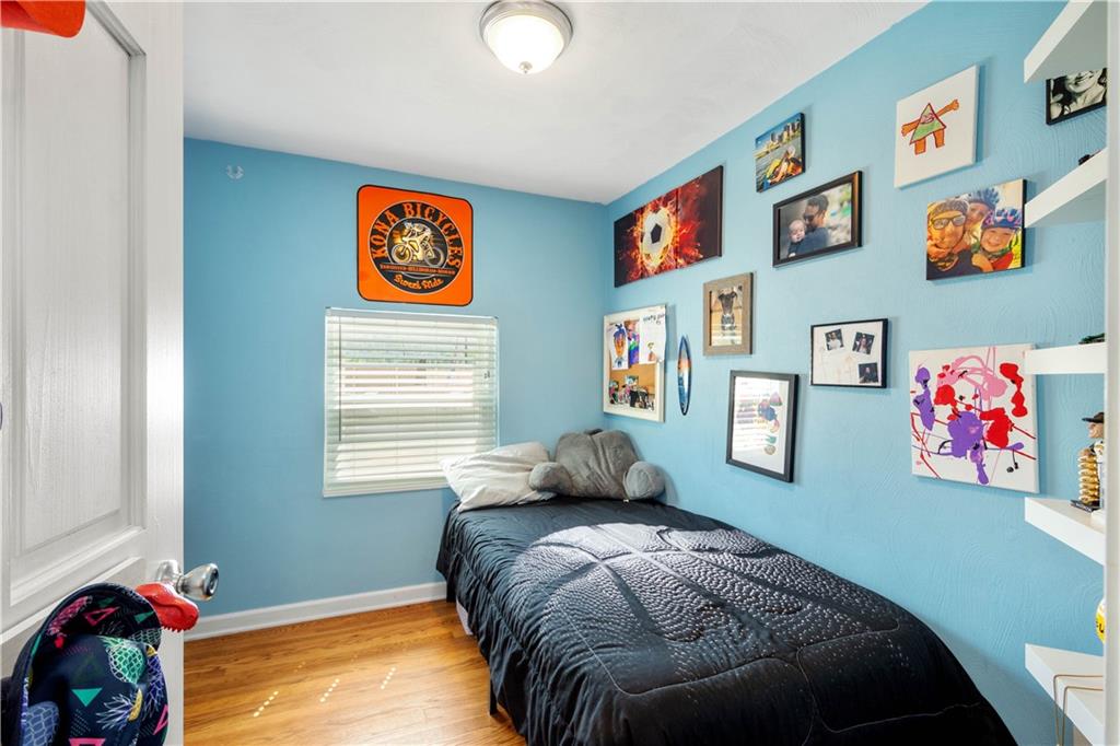 200 Fox Chapel Road Pittsburgh, PA 15238 - Photo 18 of 32 a bedroom with bed and painting on the wall
