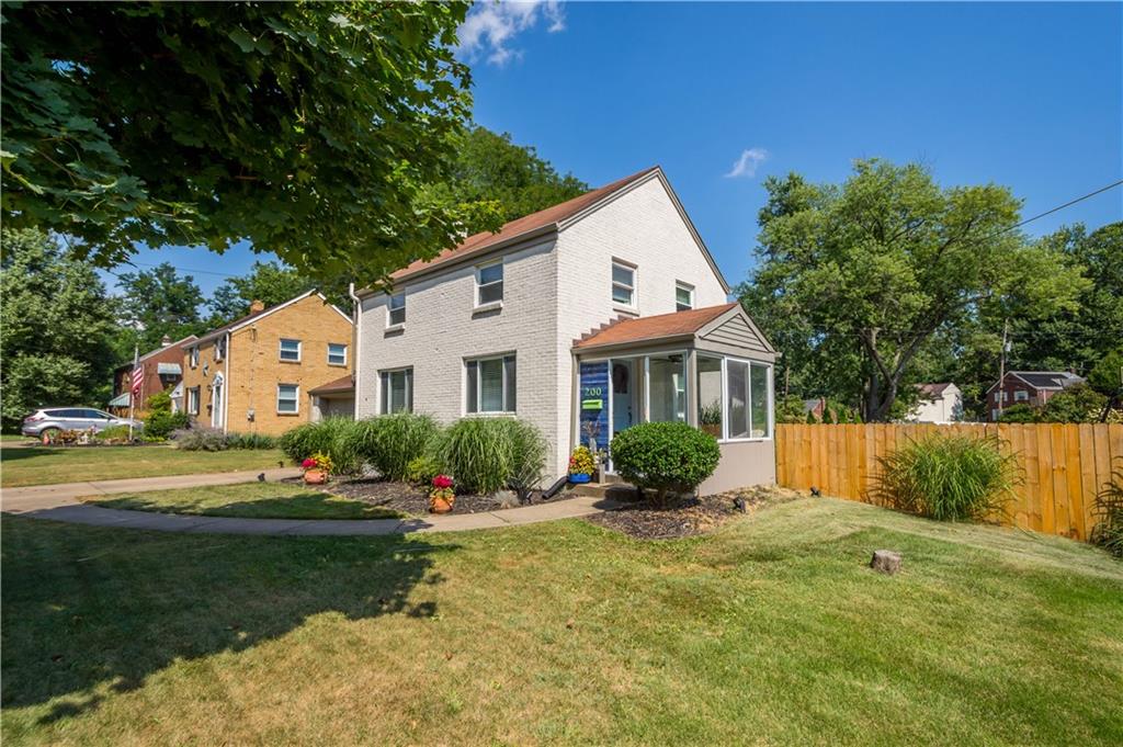 200 Fox Chapel Road Pittsburgh, PA 15238 - Photo 2 of 32 a front view of a house with garden