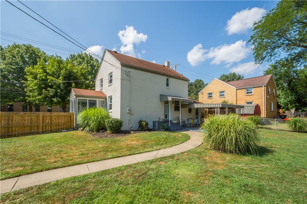 200 Fox Chapel Road Pittsburgh, PA 15238 - Photo 26 of 32 a view of a house next to a yard with plants and trees