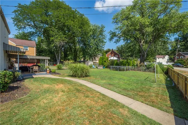 a view of a backyard with sitting area