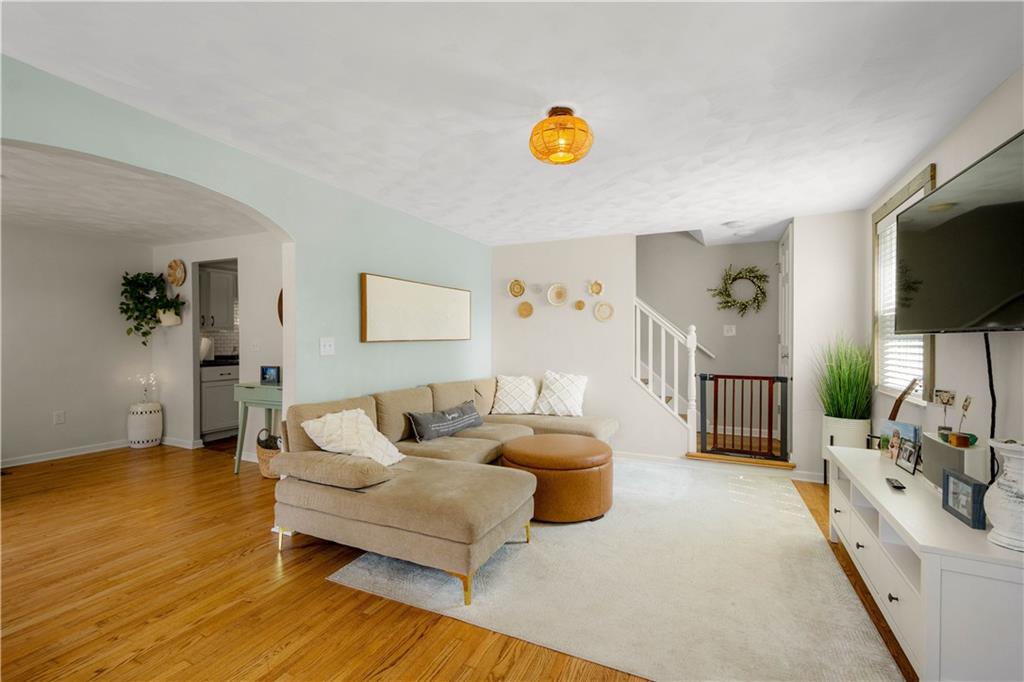 200 Fox Chapel Road Pittsburgh, PA 15238 - Photo 5 of 32 a living room with furniture and a flat screen tv