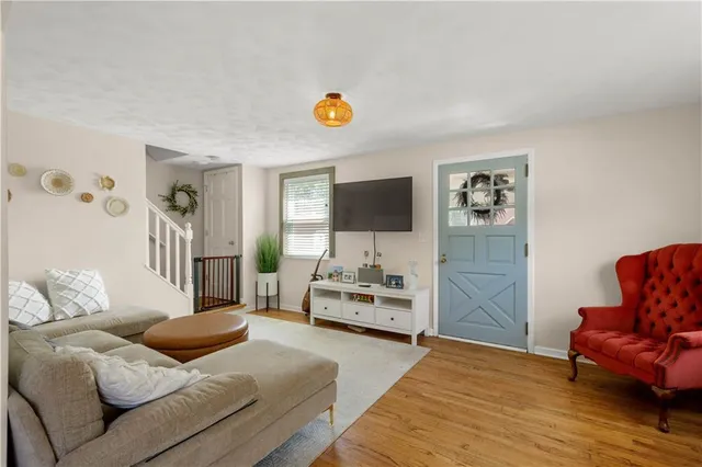 a bedroom with furniture and a flat screen tv