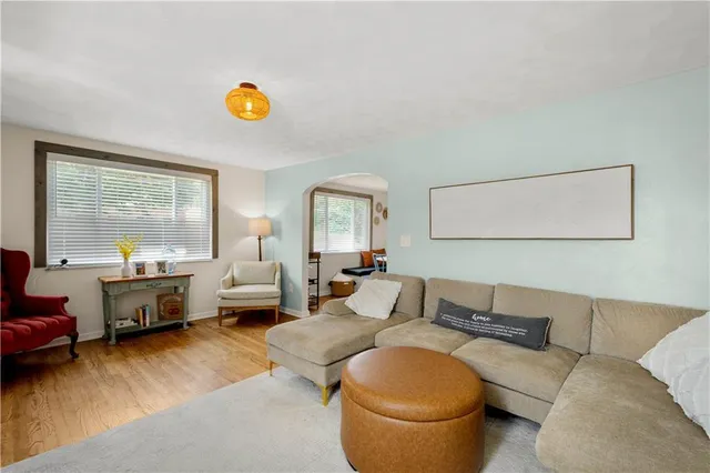 a living room with furniture and a table