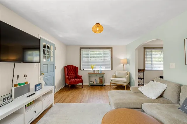a living room with furniture fireplace and flat screen tv