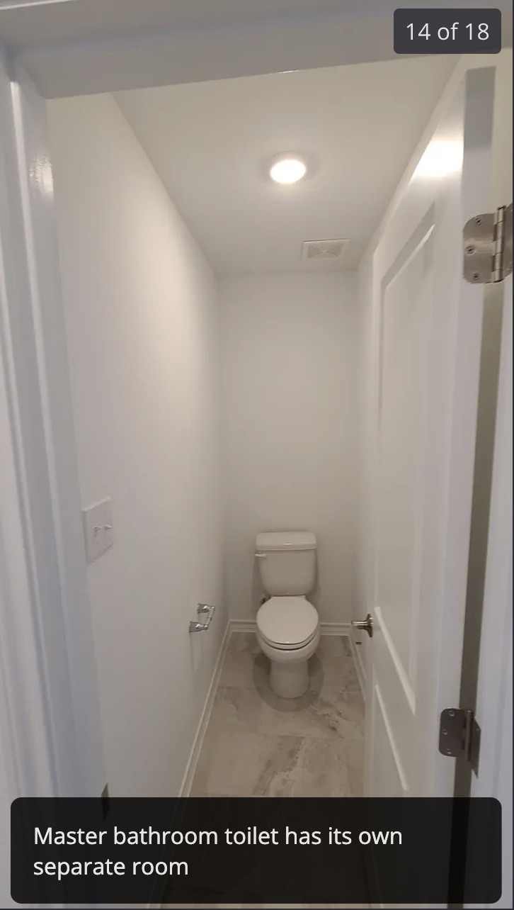 561 Pepperbark Loop Buda, TX 78610 - Photo 14 of 15 Bathroom featuring toilet and baseboards