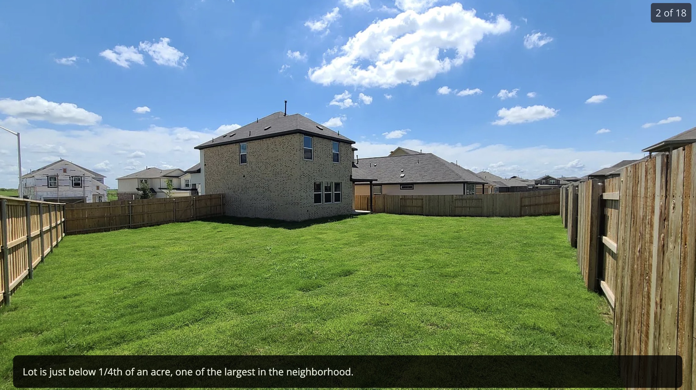 561 Pepperbark Loop Buda, TX 78610 - Photo 2 of 15 Rear view of property featuring a residential view and a fenced backyard