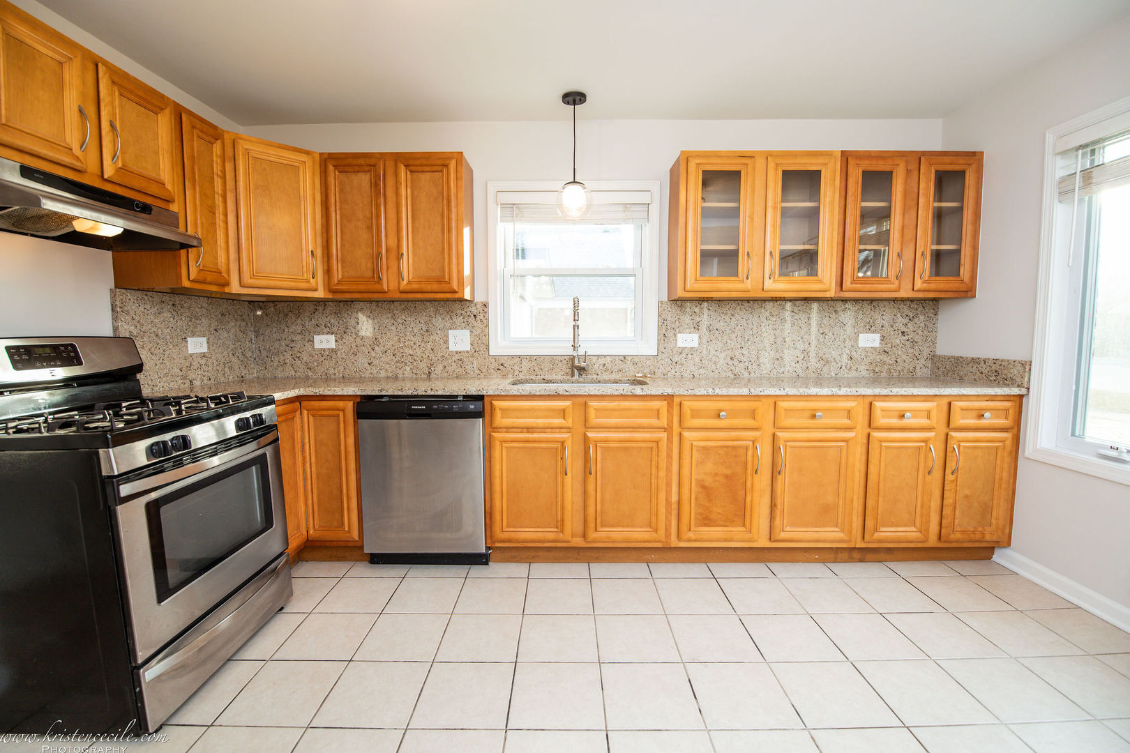 10625 Austin Avenue Chicago Ridge, IL 60415 - Photo 8 of 22 a kitchen with stainless steel appliances granite countertop a stove a sink and a microwave